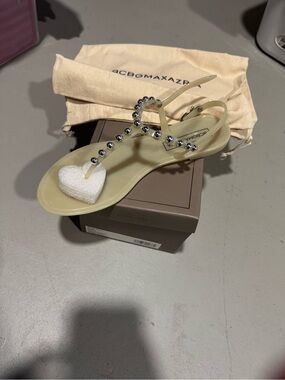 BCBG Jelly T-Strap Sandal in Pale Yellow with Heart Accent